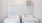 a white washing machine and a white laundry basket