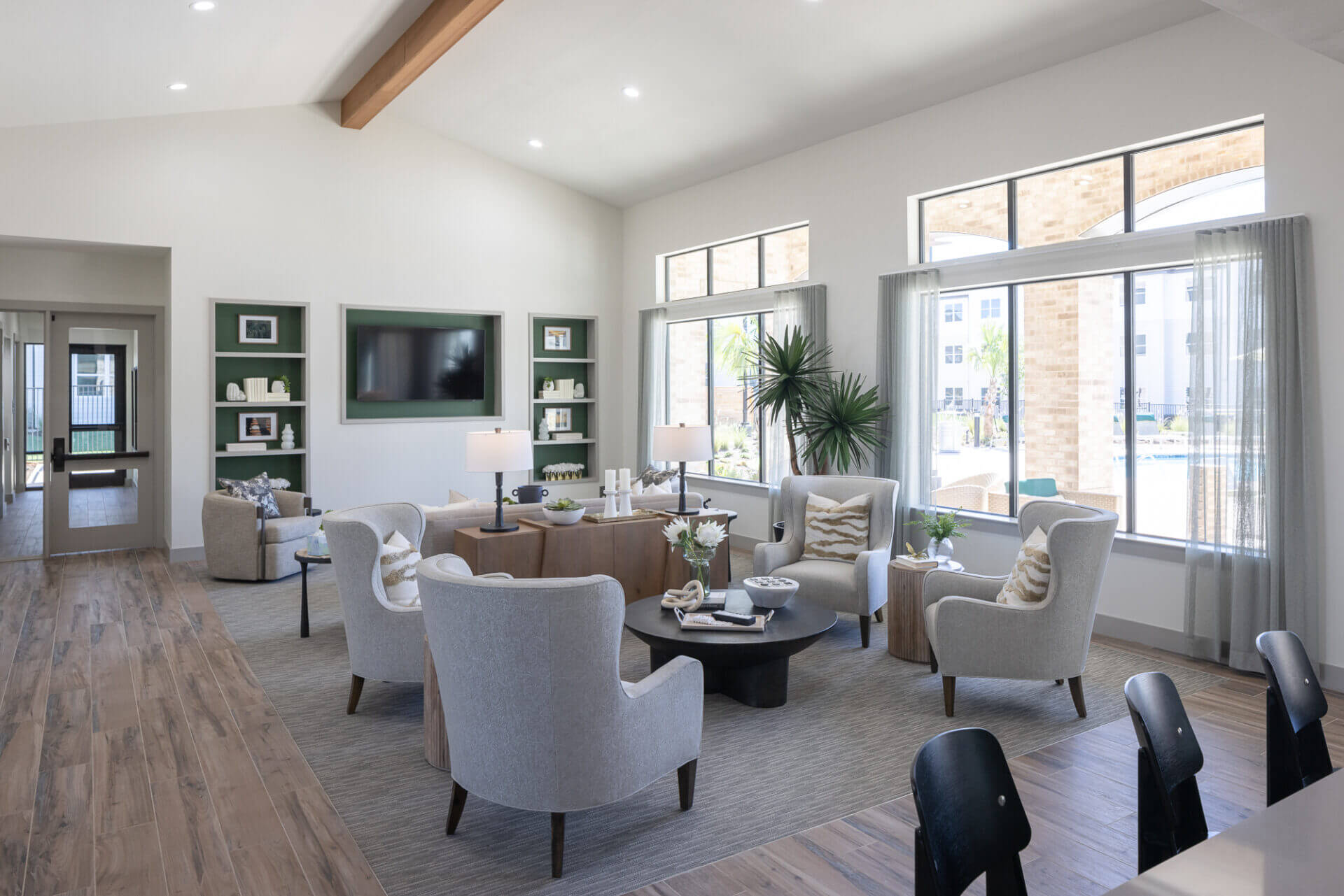 clubhouse with ample seating spaces and large windows allowing for bright natural light at prose thunder rock in marble falls, tx