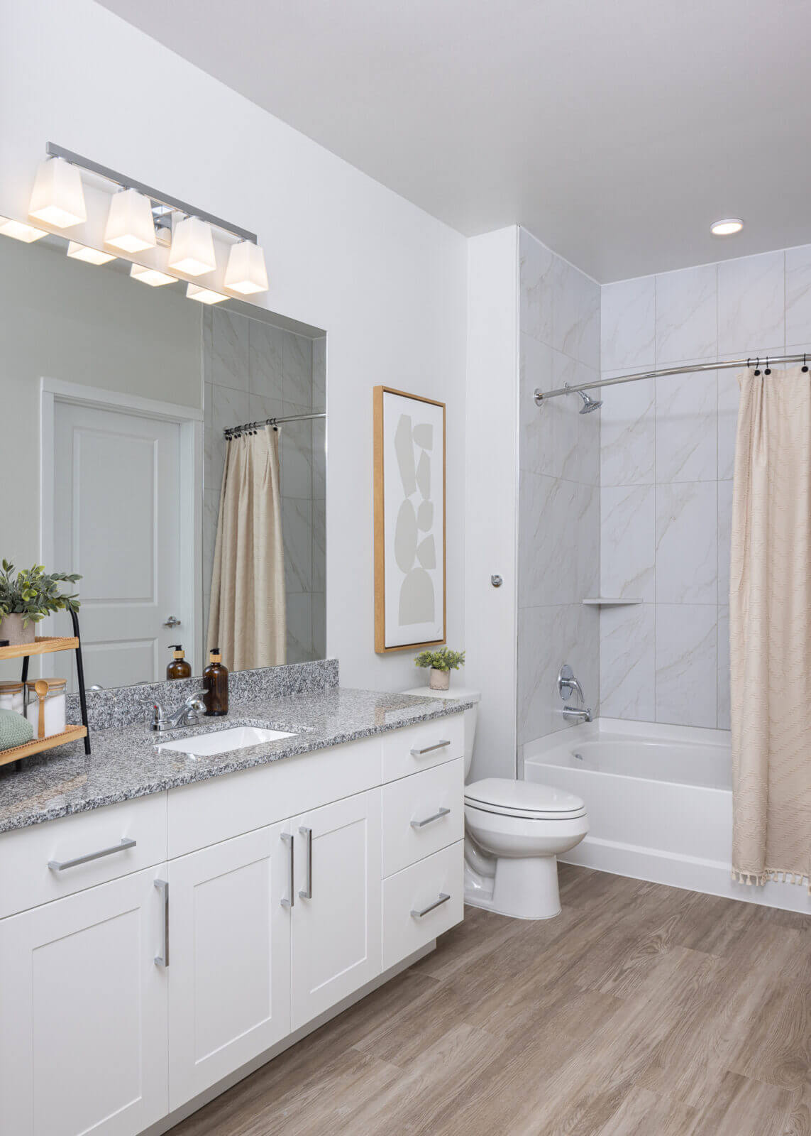 Bathroom with white cabinets, chrome hardware, and chrome faucet in marble falls, tx